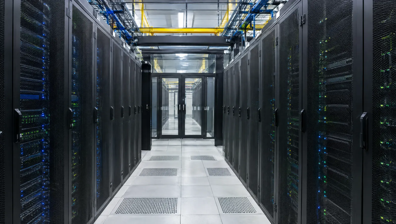 Cold aisle inside an Indian data centre server hall, a load that runs continuously around the clock.