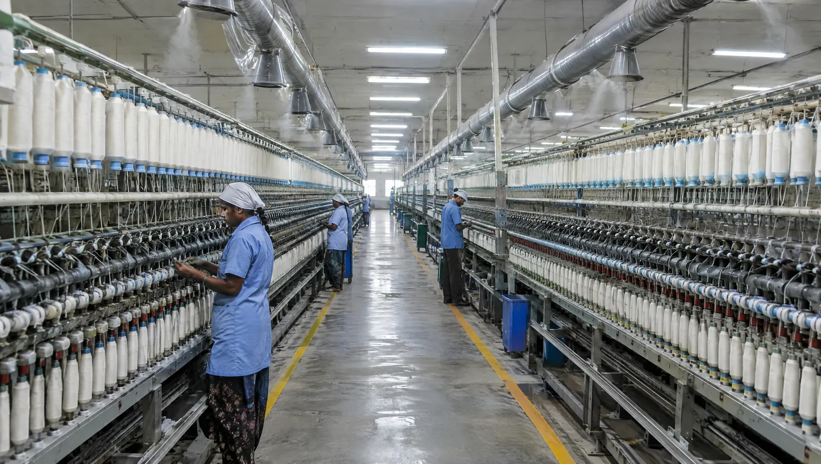 Rows of ring spinning frames inside an Indian cotton spinning mill, one of the largest continuous electrical loads in a textile unit.